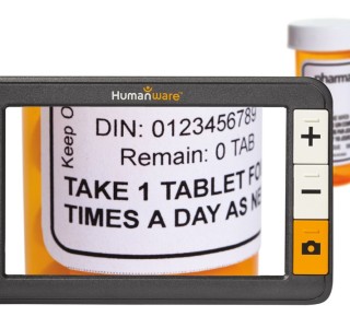 The explore 5 is seen in front of  bottle of pills, which shows magnified on its screen.